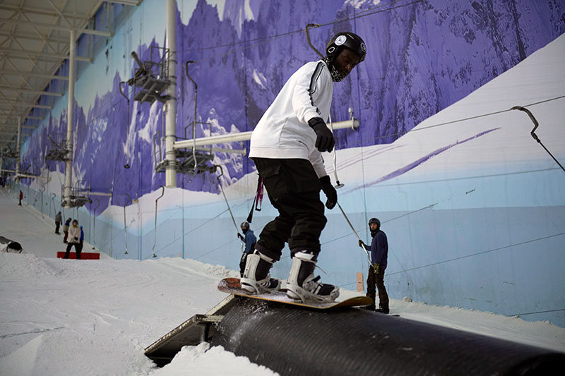 Snowboarder riding a pipe