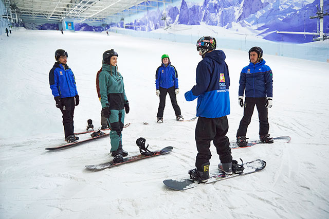 Group of snowboarders on a lesson at Chill Factor<sup>e</sup>